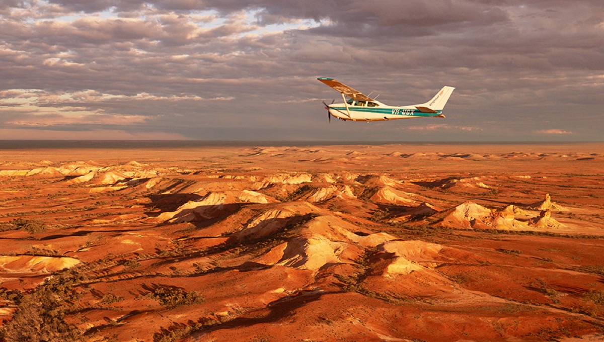 A small aircraft above the ochre and white Breakaways